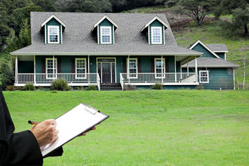 a real estate appraiser appraising a large country house